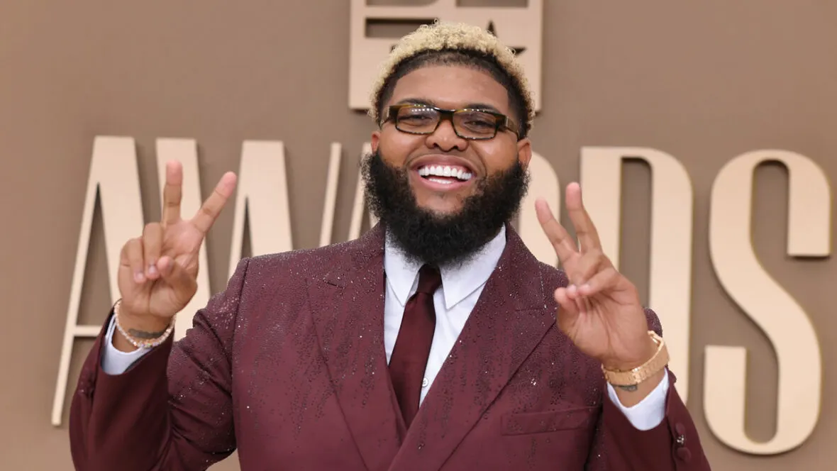 Druski Steps Up as BET Awards 2026 Host in Rhinestone Maroon Suit