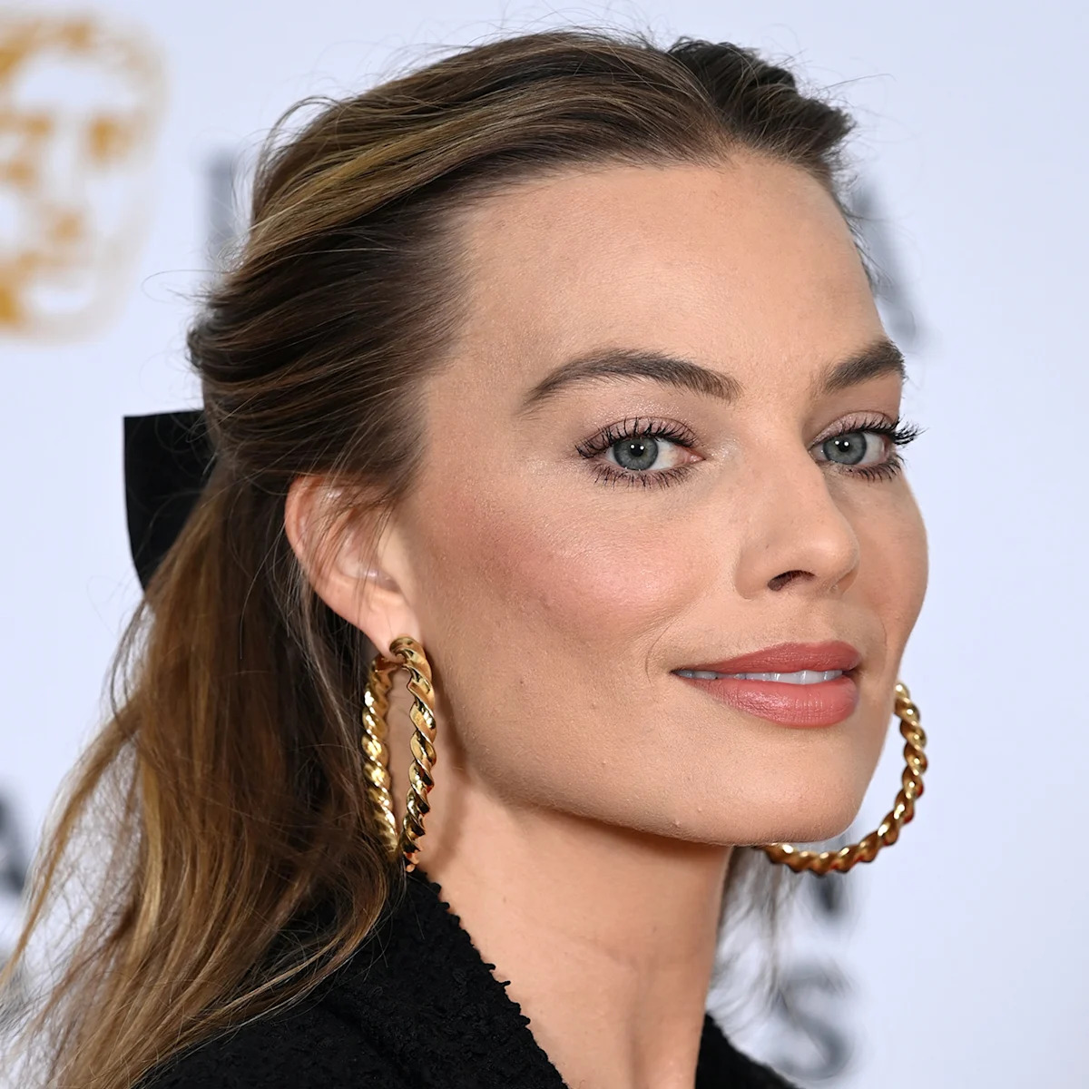 Margot Robbie Braves London Heatwave in Chic All-Black Look