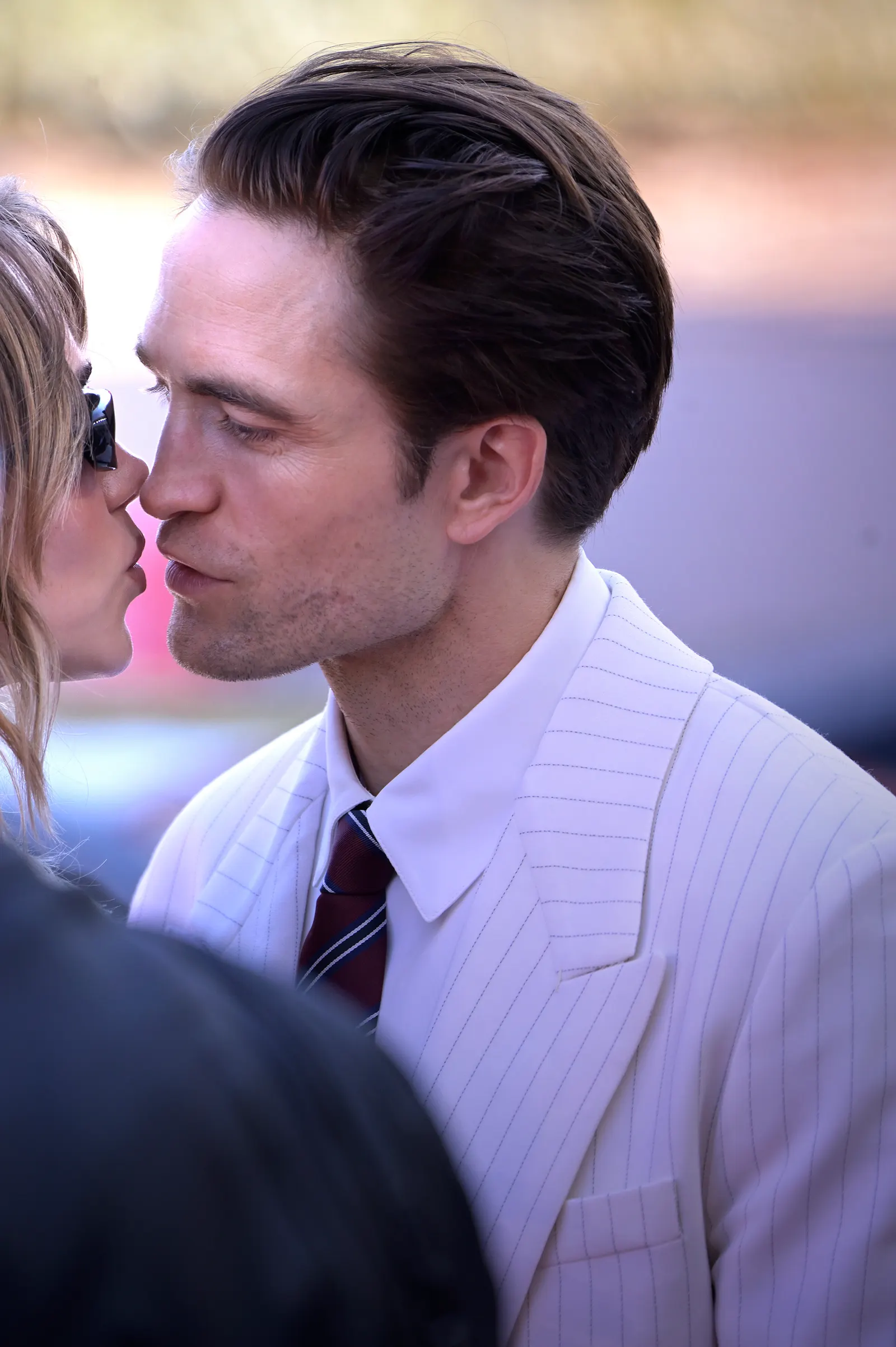 Pattinson and Waterhouse Share Venice Kisses at 'Primetime' Premiere
